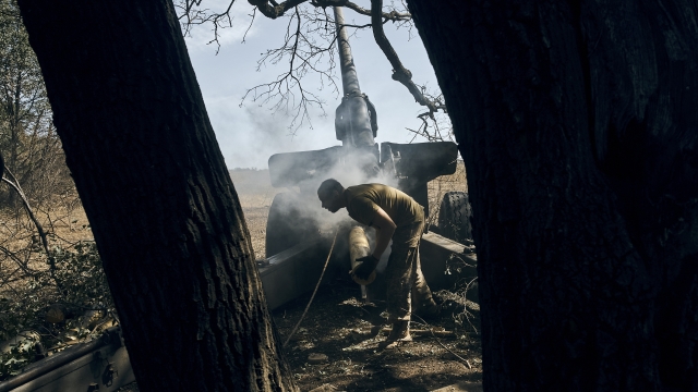 A Ukrainian soldier fires on the front line in the Donetsk region, eastern Ukraine