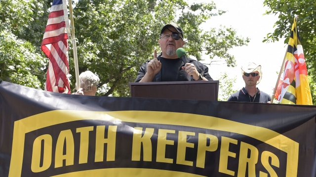 Stewart Rhodes, founder of the Oath Keepers, center, speaks during a rally