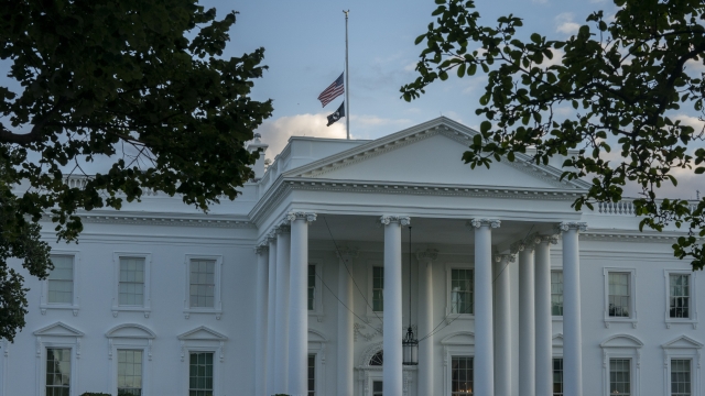 The American flag flies at half-staff over the White House