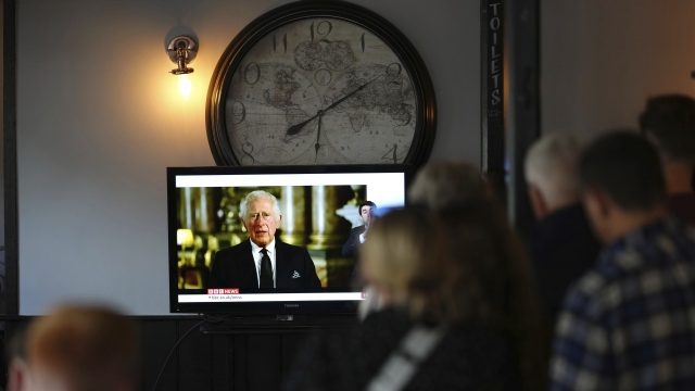Members of the public watching a broadcast of King Charles III first address to the nation as the new King
