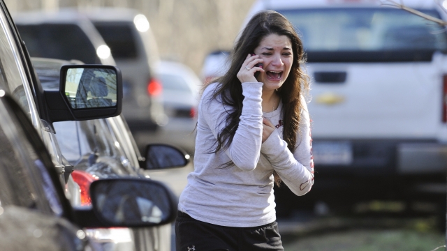A woman crying after the Sandy Hook school shooting.