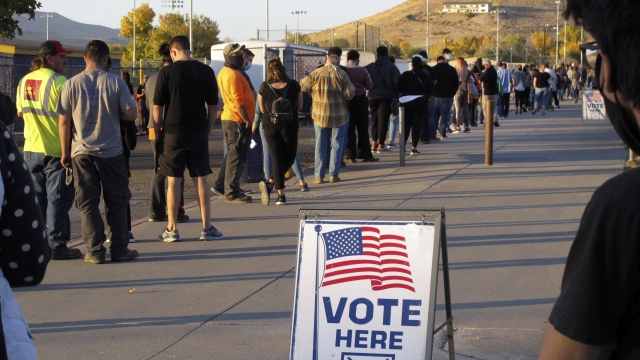 People line up to vote outside a polling location