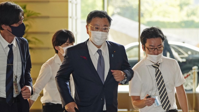 Japan's Chief Cabinet Secretary Hirokazu Matsuno, center