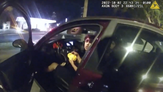 Body camera footage shows Erik Cantu looking at San Antonio Police Officer James Brennand while holding a burger in his car.