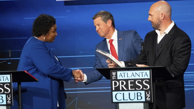 Georgia gubernatorial candidates Stacey Abrams, Gov. Brian Kemp and Shane Hazel on the debate stage