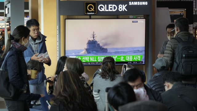 TV screen shows a South Korean navy vessel.