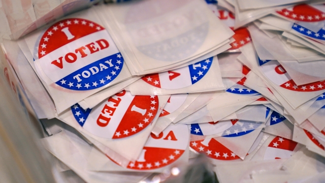 A pile of voting stickers
