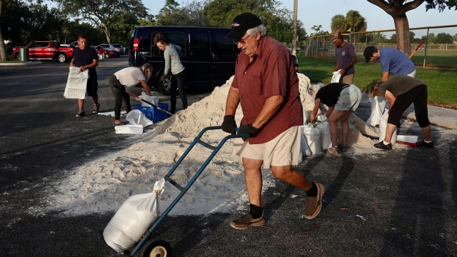 Floridians moving sand bags ahead of subtropical storm Nicole.
