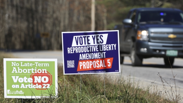 signs opposing and supporting a proposed amendment to the Vermont constitution that would guarantee access to abortion rights