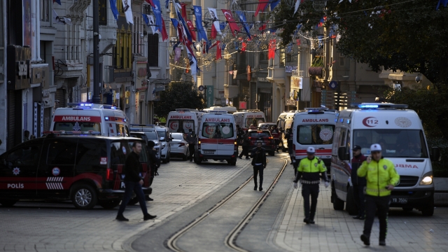 Police vehicles and ambulances are parked at the site of an explosion on Istanbul's popular pedestrian Istiklal Avenue.