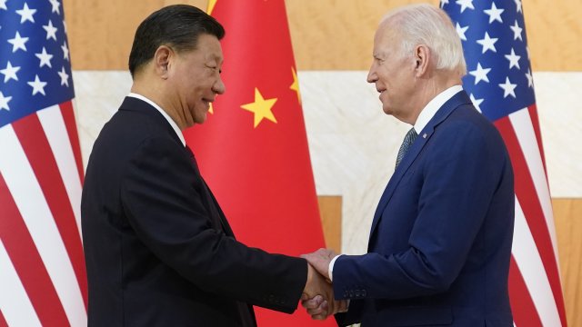 U.S. President Joe Biden, right, and Chinese President Xi Jinping shake hands before a meeting