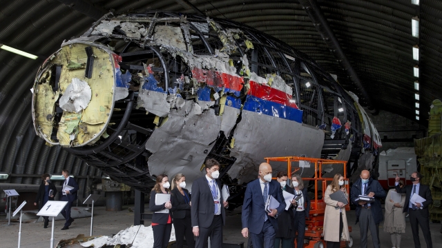 Judges and lawyers view the reconstructed wreckage of Malaysia Airlines Flight MH17.