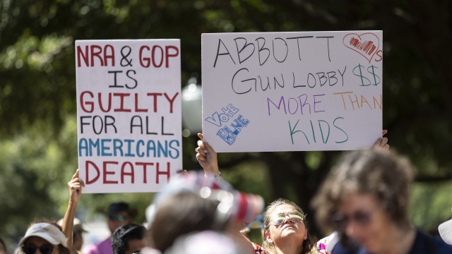 People demonstrate at a March for our Lives rally at the Texas State Capitol