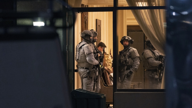 York Regional Police tactical officers stand in the lobby of a condominium building in Vaughan, Ontario