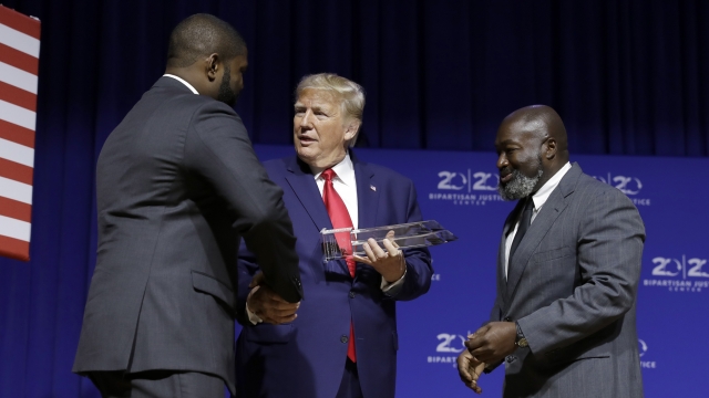 President Donald Trump is awarded the Bipartisan Justice Award by Matthew Charles