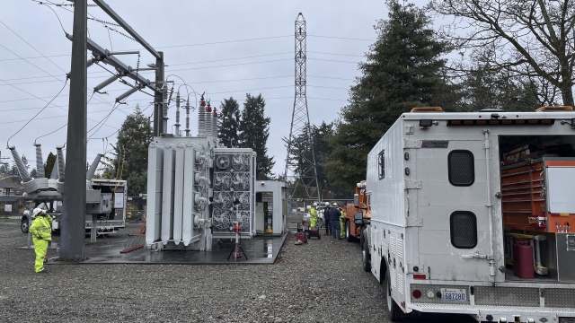 A Tacoma Power crew works at an electrical substation damaged by vandals early on Christmas morning.