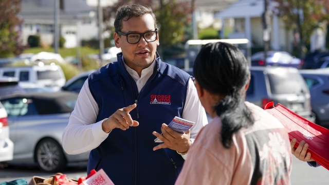 Rep.-elect George Santos talks to a voter