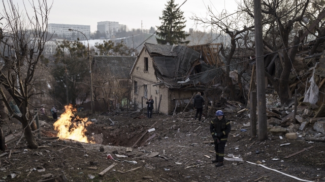 Emergency workers arrive at a residential area hit during a Russian attack in Kyiv, Ukraine.