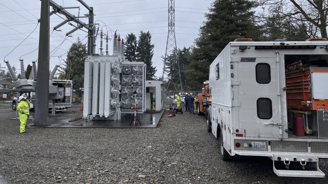 A Tacoma Power crew works at an electrical substation damaged by vandals early on Christmas morning.