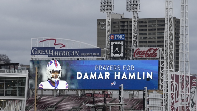 A scoreboard at Great American Ballpark displays a photo of Buffalo Bills' Damar Hamlin.