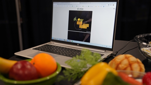 A food waste monitor from Orbisk is shown at a Consumer Electronics Show display.