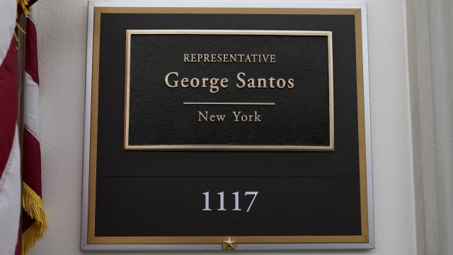 A sign stands outside the office of Rep. George Santos, R-N.Y., on Capitol Hill
