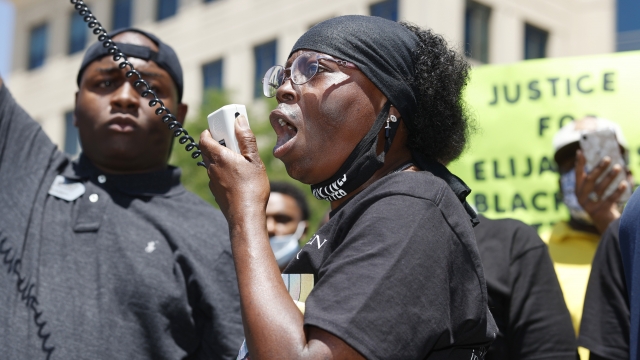 Sheneen McClain speaks during a rally and march over the death of her son, Elijah McClain.
