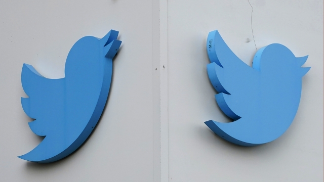 Twitter logos are displayed outside the company's offices in San Francisco