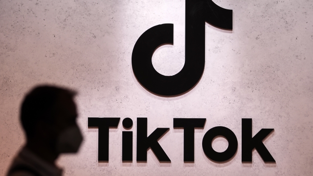 A visitor passes the TikTok exhibition stands at the Gamescom computer gaming fair in Cologne, Germany