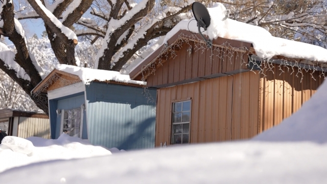 Snow on the roofs of mobile homes.
