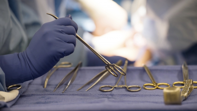 Surgical instruments are used during an organ transplant surgery at a hospital