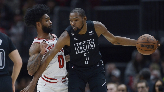 Brooklyn Nets' Kevin Durant looks to drive against Chicago Bulls' Coby White.