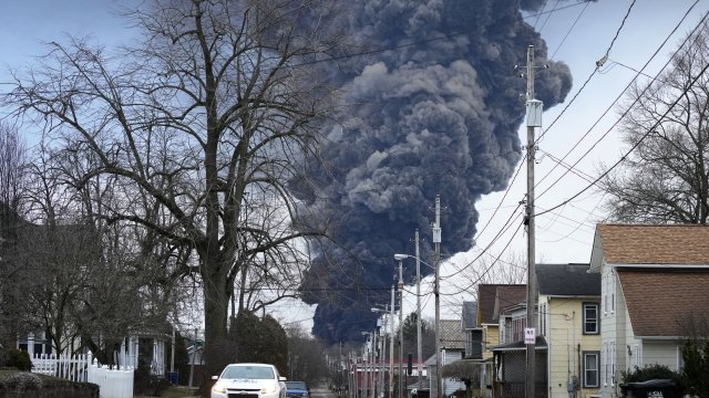 A black plume rises over East Palestine, Ohio, as a result of a controlled detonation