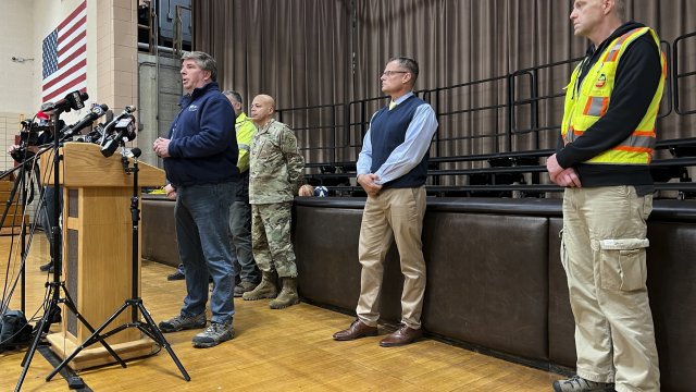 Emergency response officials speak with reporters in East Palestine, Ohio