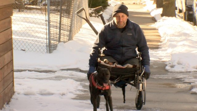 Matt Felton, a wheelchair-bound man, clears snow and ice to raise awareness.