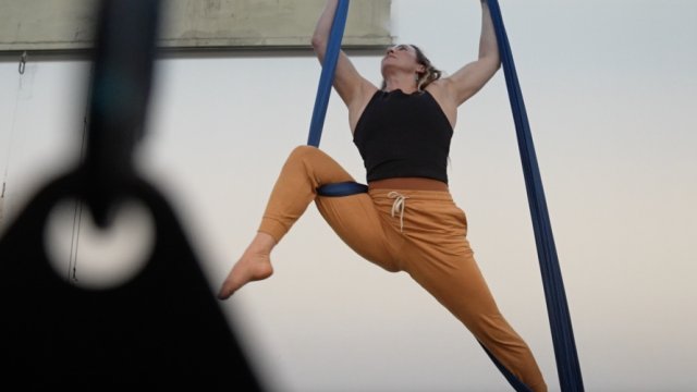 Woman performs aerial acrobatics