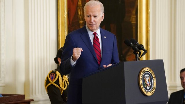 President Biden standing at podium.