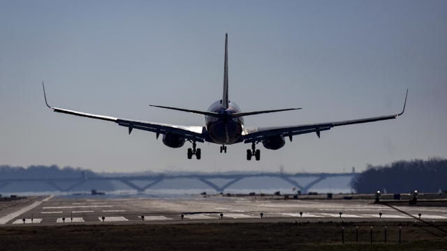 A plane lands at Ronald Reagan Washington National Airport in Arlington, Va.
