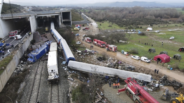 The wreckage of trains in Greece lie on the rail lines after a collision.