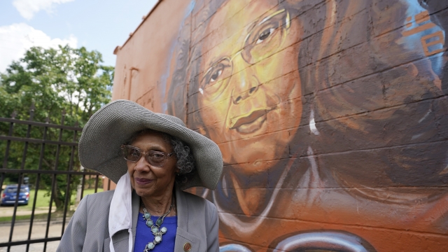 State Rep. Alyce Clarke, D-Jackson, stands alongside a mural honoring civil rights legends