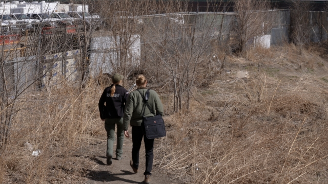 A park ranger and a mental health clinician respond to a call on an urban trail in Denver.