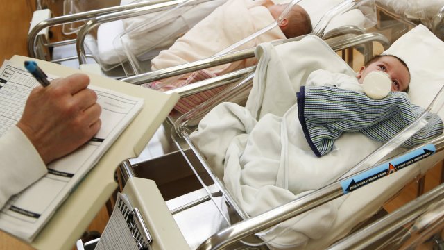 Newborn babies in a nursery