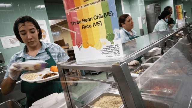 School cafeteria workers serve food