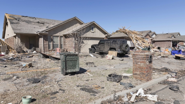 Homes sits damaged along Frost Lane