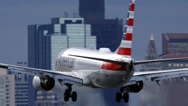 An American Airlines plane lands at Logan International Airport.