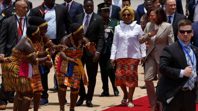 U.S. Vice President Kamala Harris is greeted by traditional dancers as she arrives in Accra, Ghana.