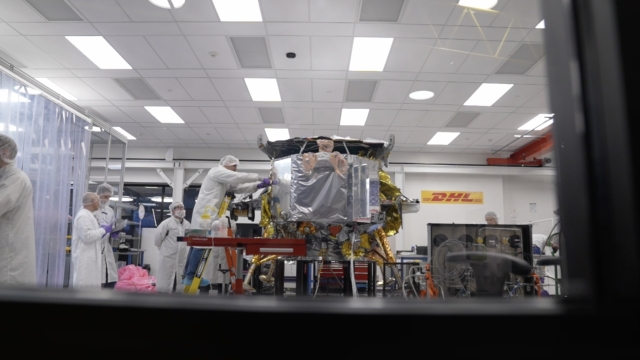 A team from the company Astrobotic puts the finishing touches on a space lander.
