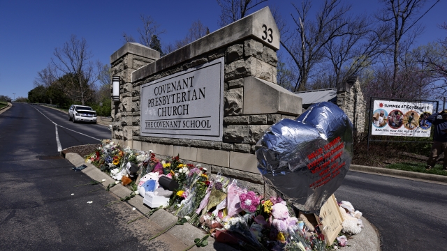 A balloon with names of the victims is seen at a memorial at the entrance to The Covenant School