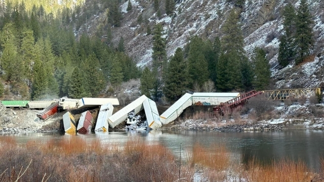 Several freight train cars derailed into the river west of Paradise, Montana.