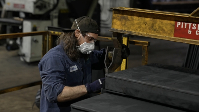 A Consol Innovations employee works on manufacturing coal foam